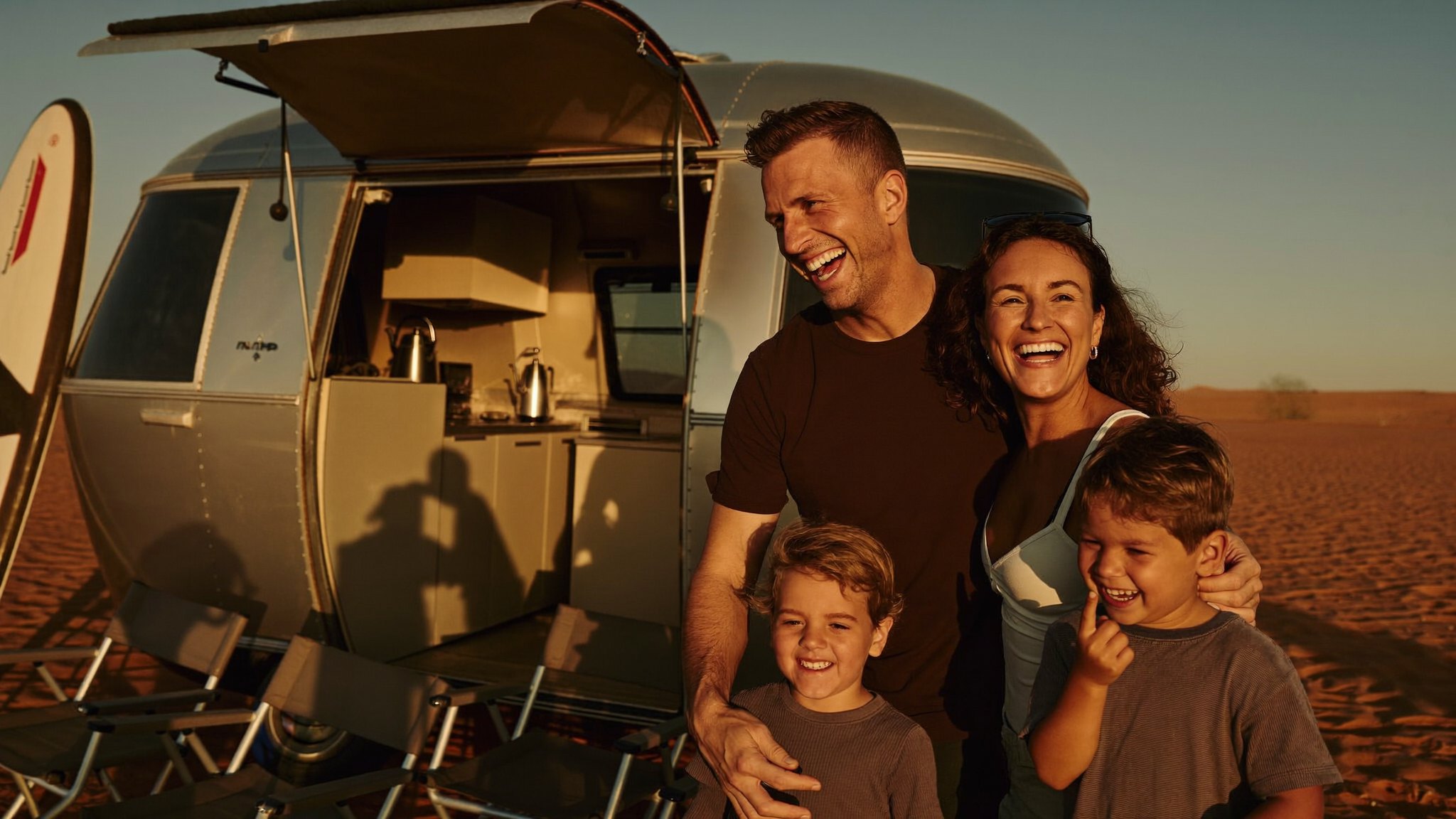 Family arriving at camp beside their BYOT trailer